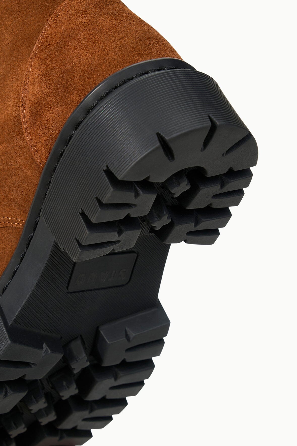 HENRY combat boot outsole detail: black lug tread on tabac suede upper