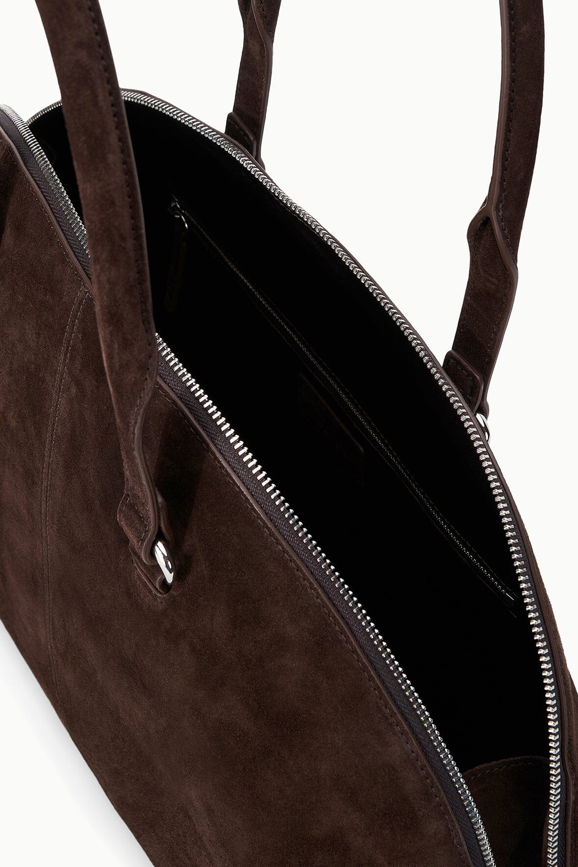 Open espresso suede satchel interior with zip closure and black lining