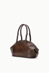 Espresso distressed mini shoulder bag with top zip, curved handles, and side straps