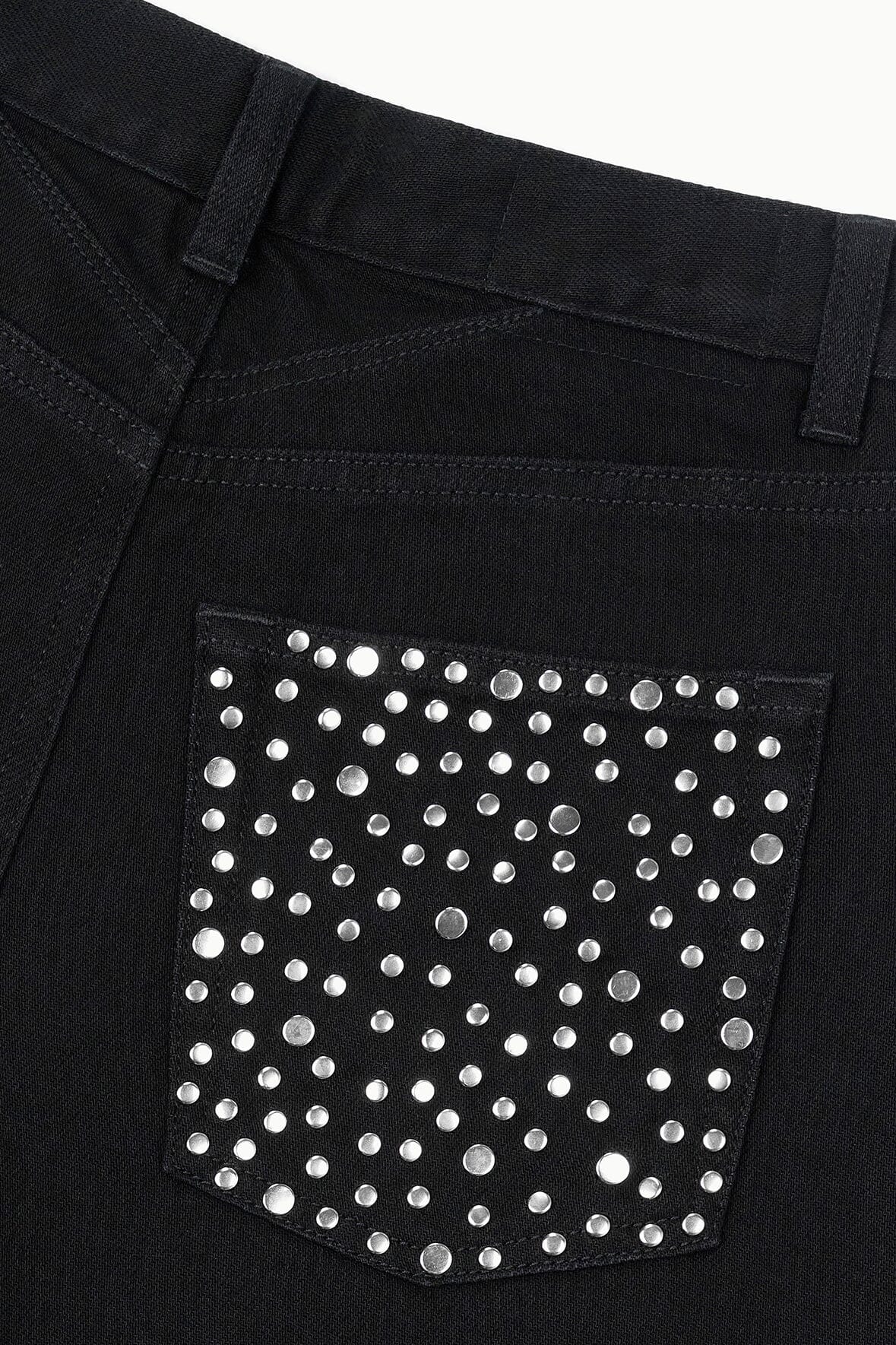 Black jeans with rhinestone-studded patch pocket on the front