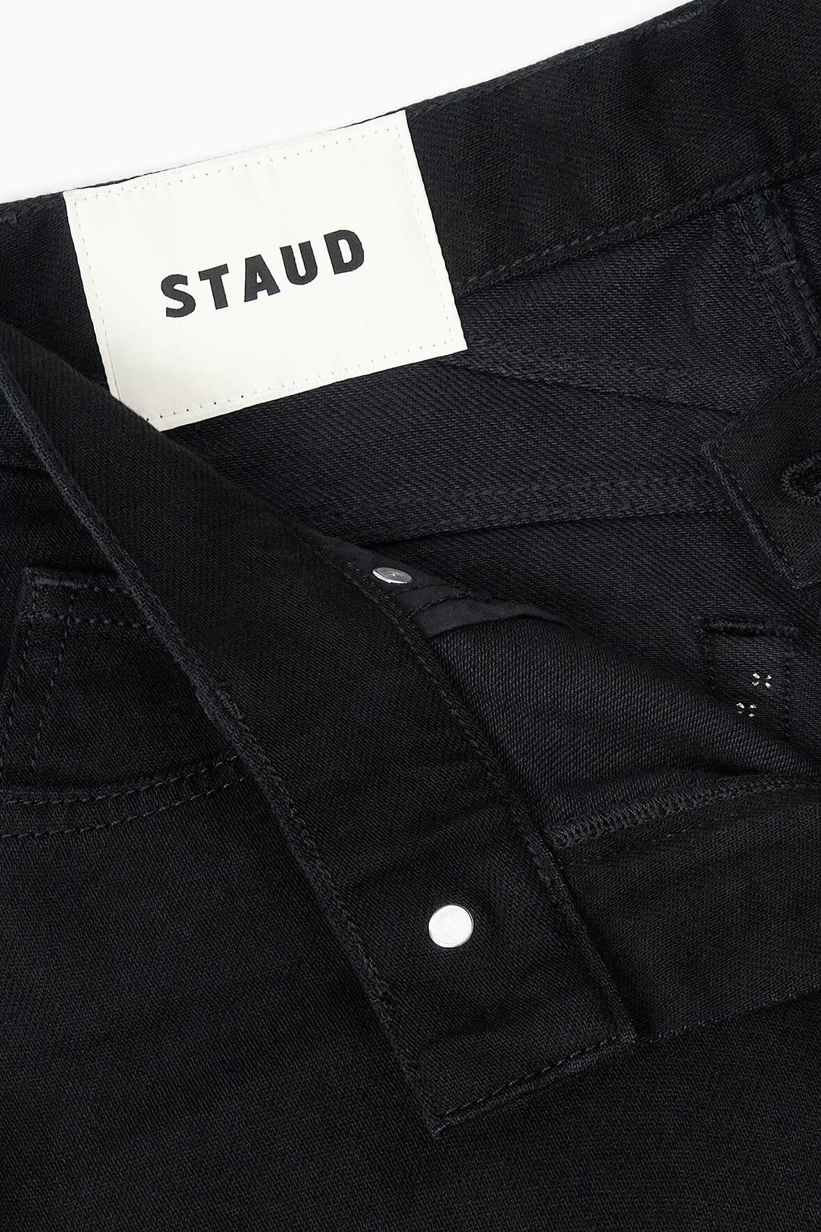 Black barrel jeans, front button and waistband label