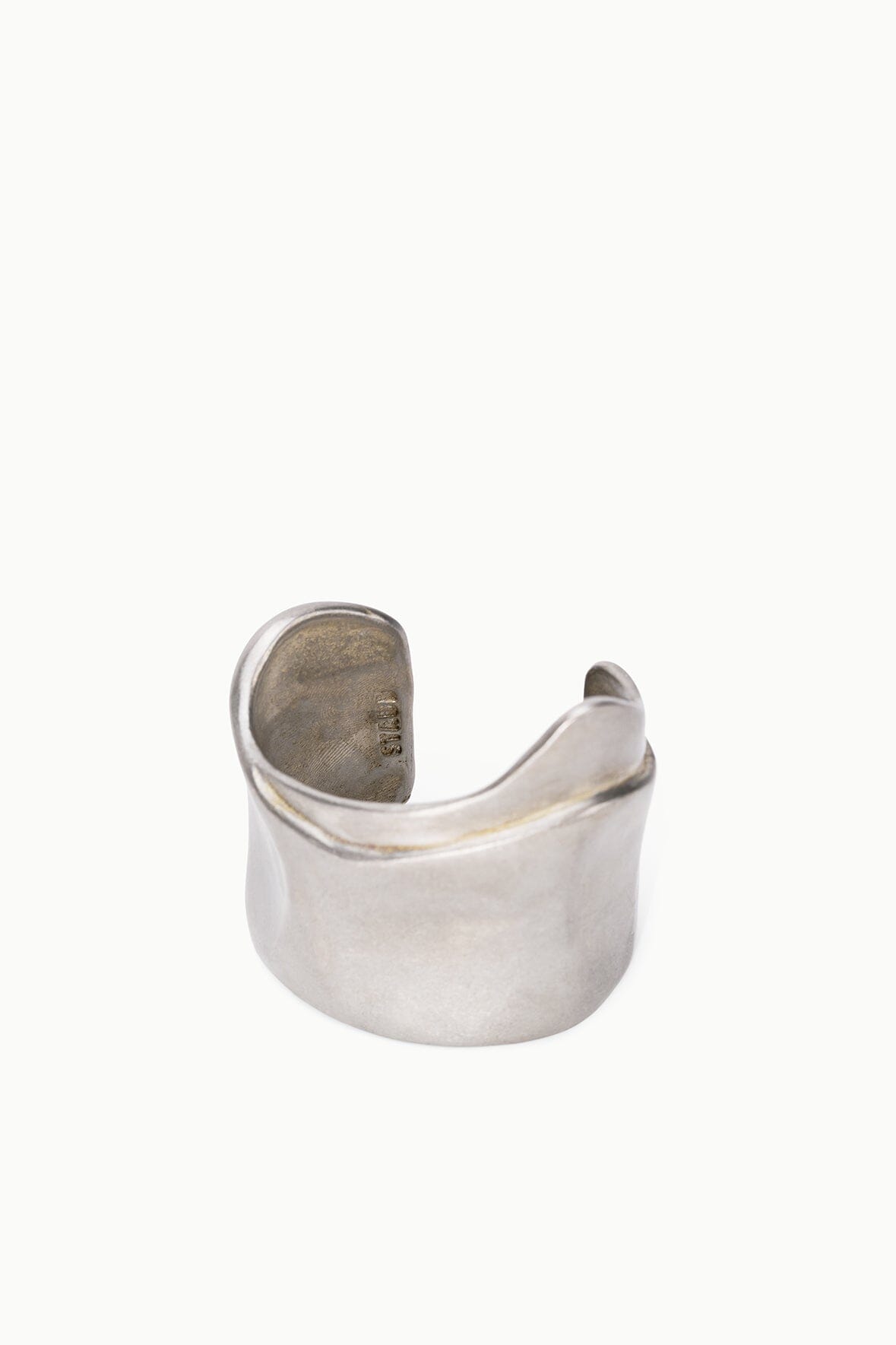 Silver-toned metal cuff bracelet with smooth rounded top edge