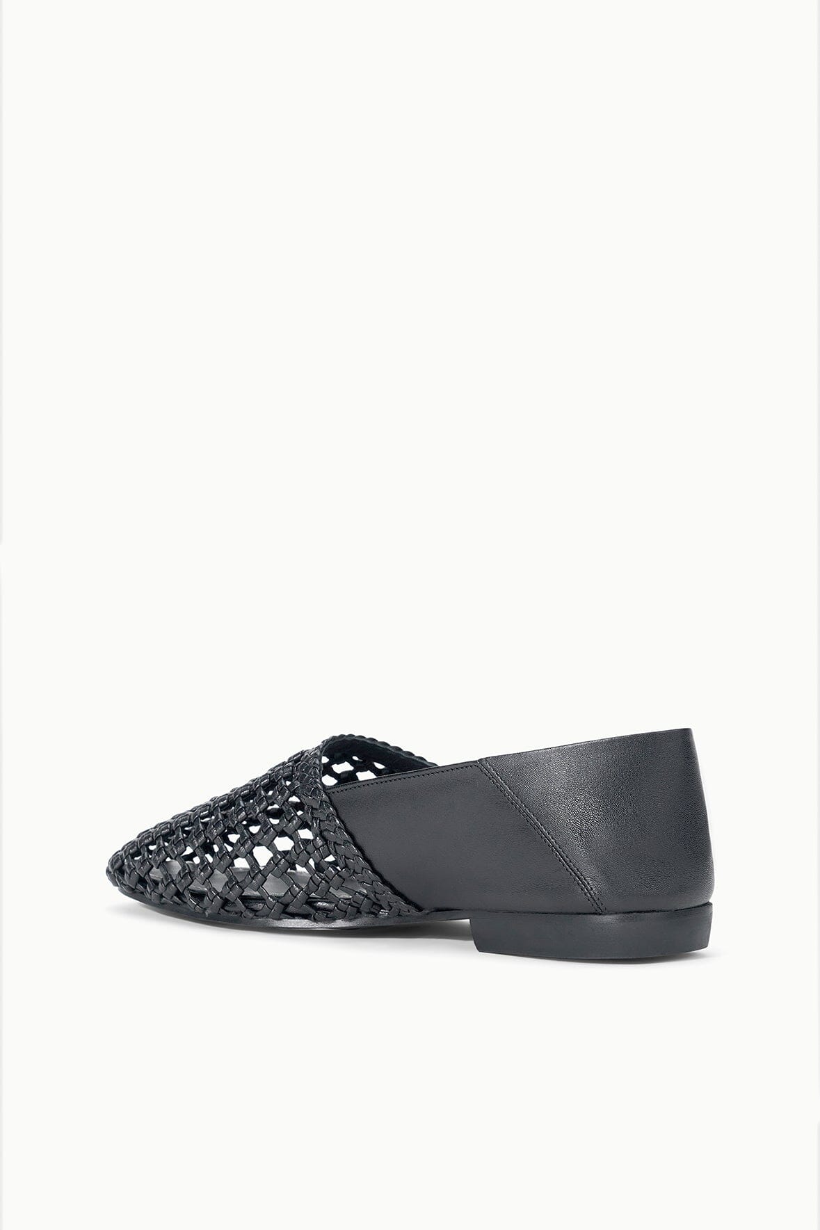 Black woven flat loafer with leather back panel and low block heel