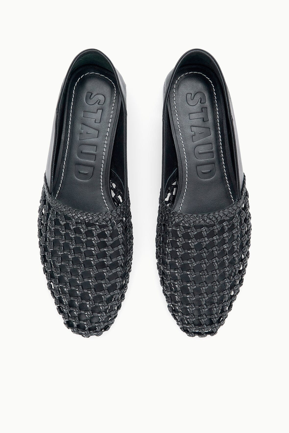 Black woven flat loafers with interior branding and twin uppers
