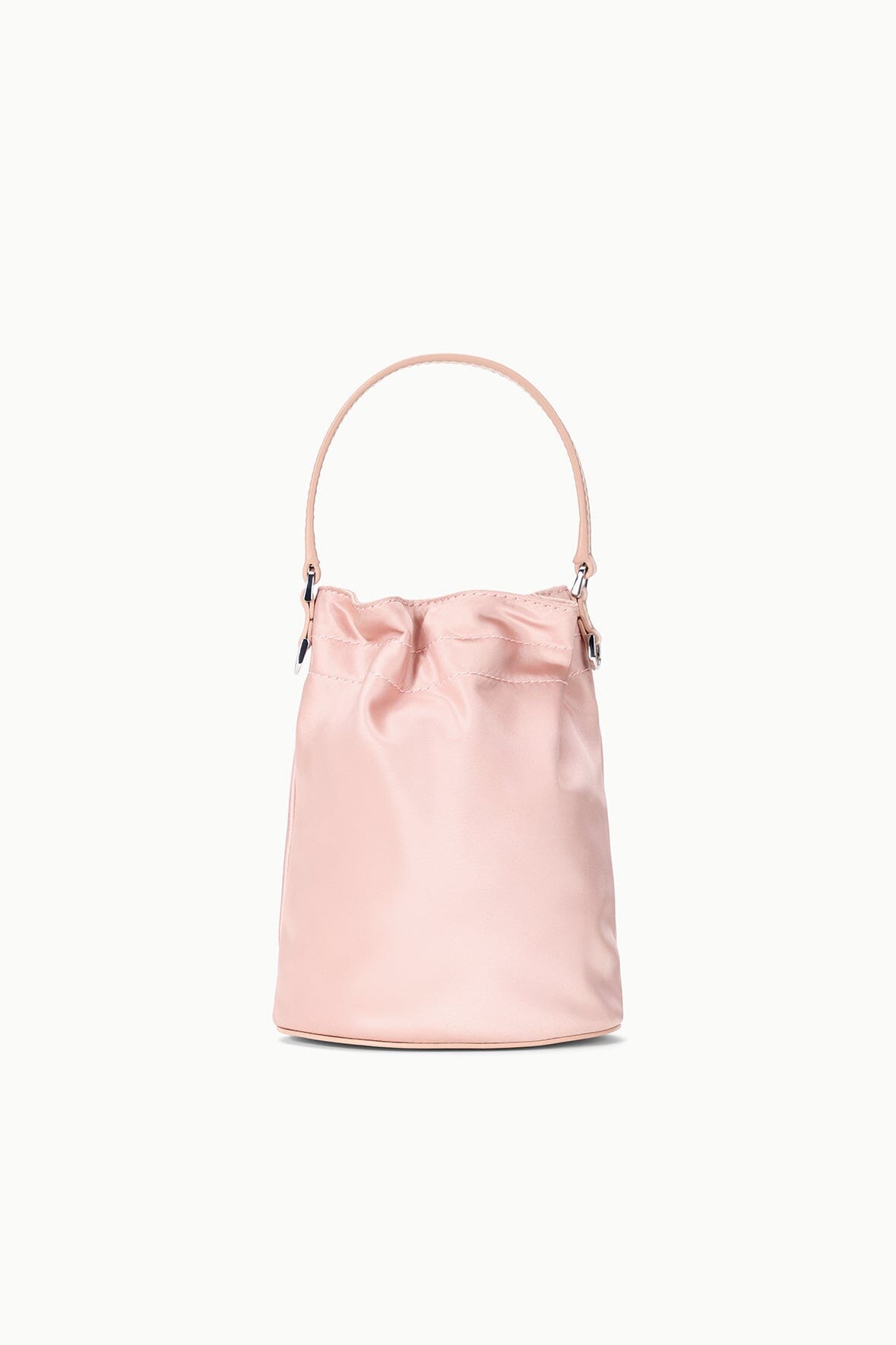 Blush mini shoulder bag with curved top handles and front pocket detail