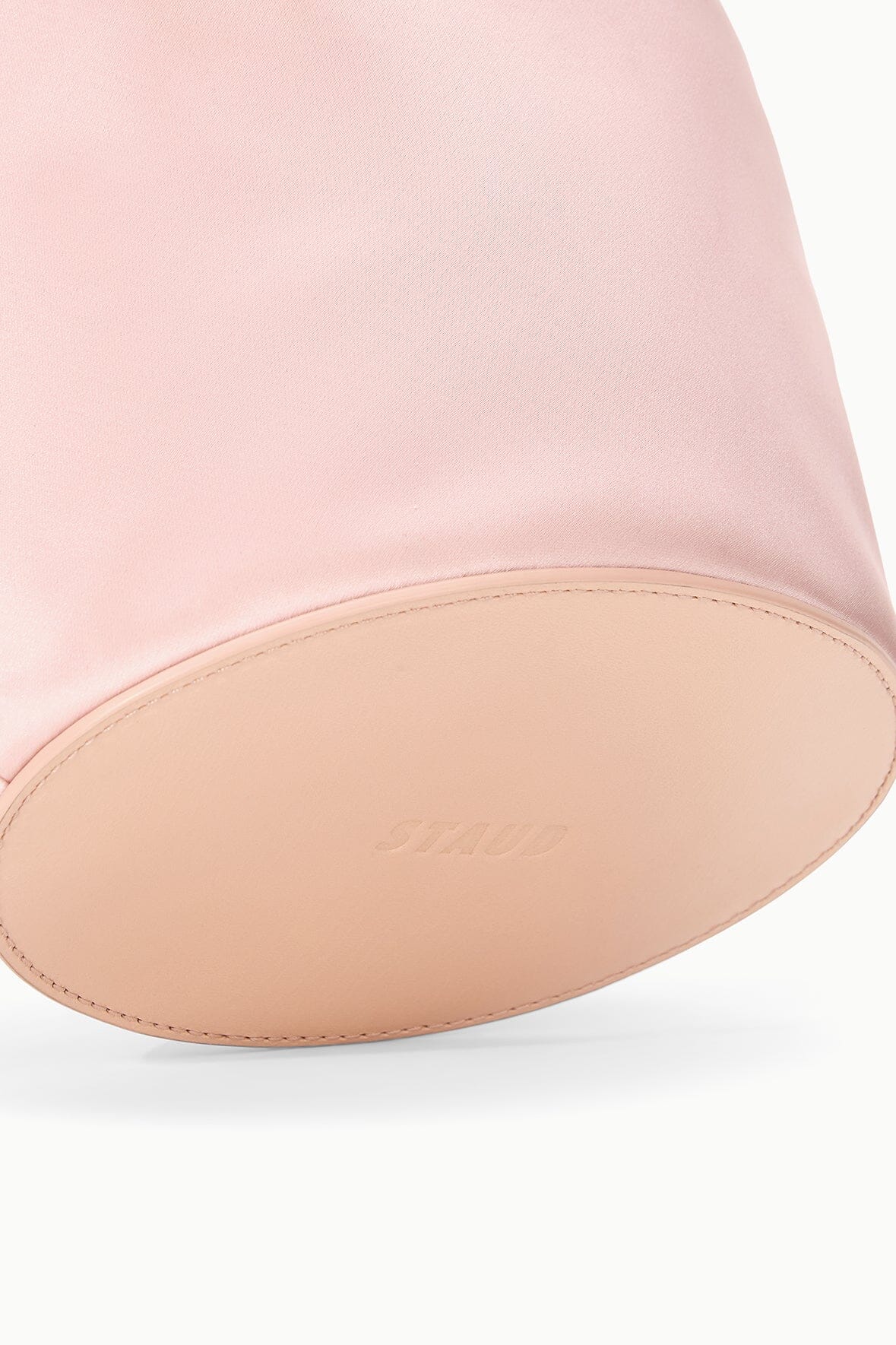 Blush mini bag base with tan leather trim and stitched edge