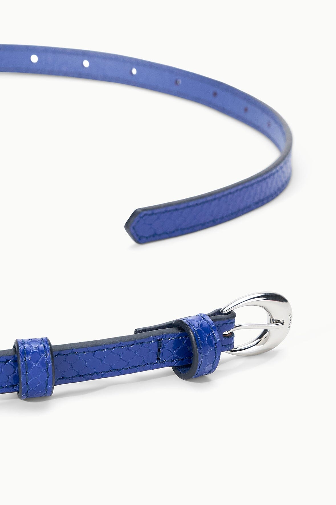 Cobalt slim buckle belt with moon-shaped metal buckle and textured leather strap