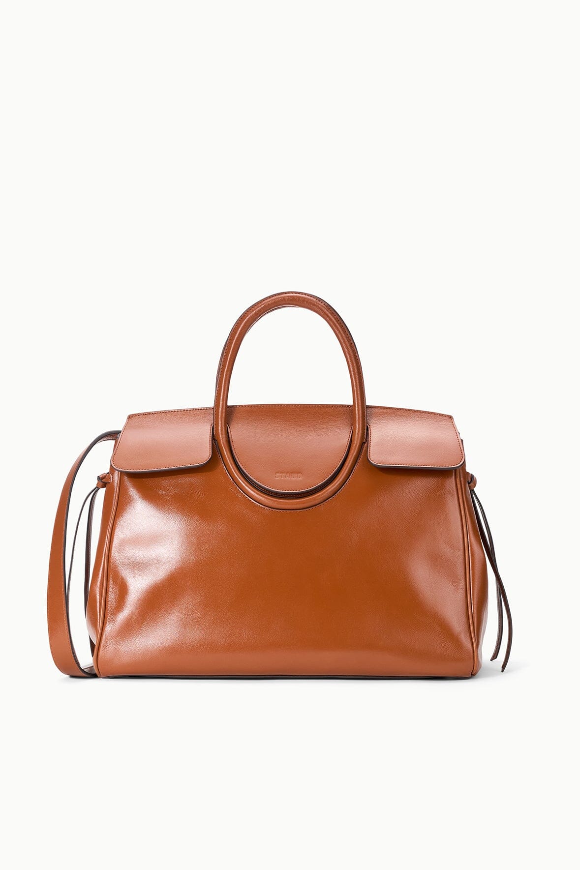 Tabac leather carryall bag with top handles, flap pockets, and adjustable shoulder strap