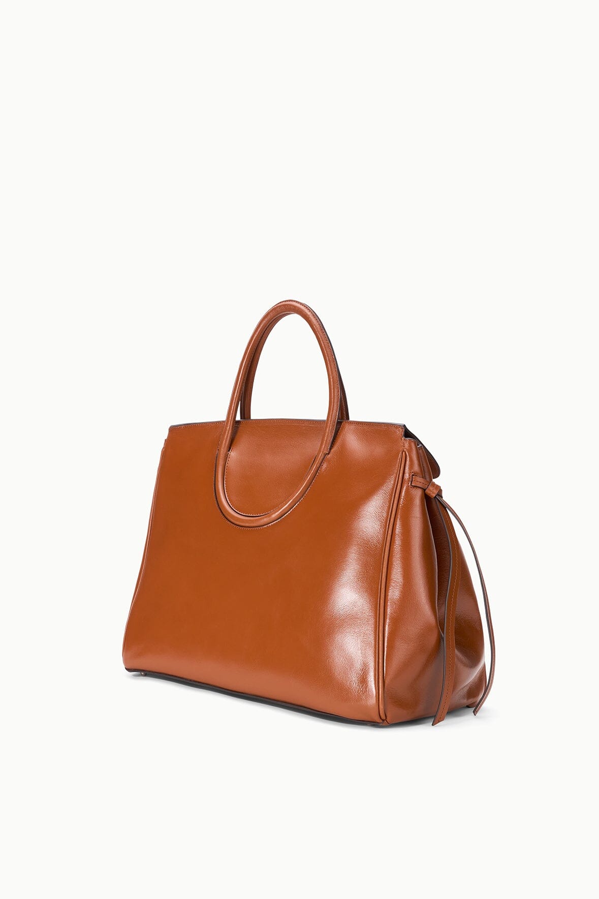 Tabac leather carryall bag, side view with top handle and crossbody strap