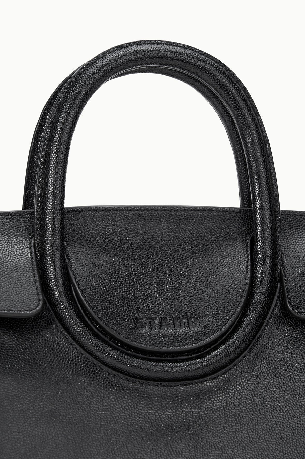 Black Maude mini carryall bag with round top handle and central logo plaque
