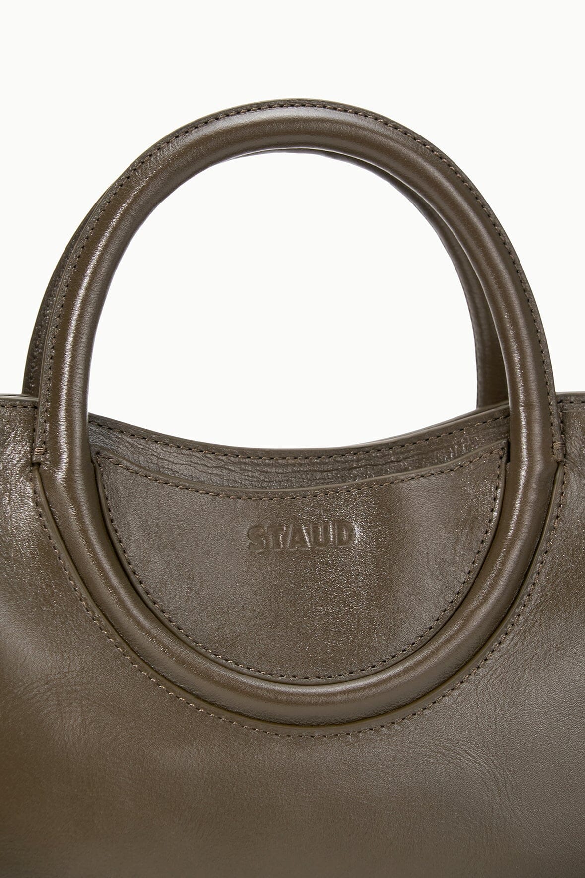 Truffle brown mini satchel top handle with stitched trim and brand stamp