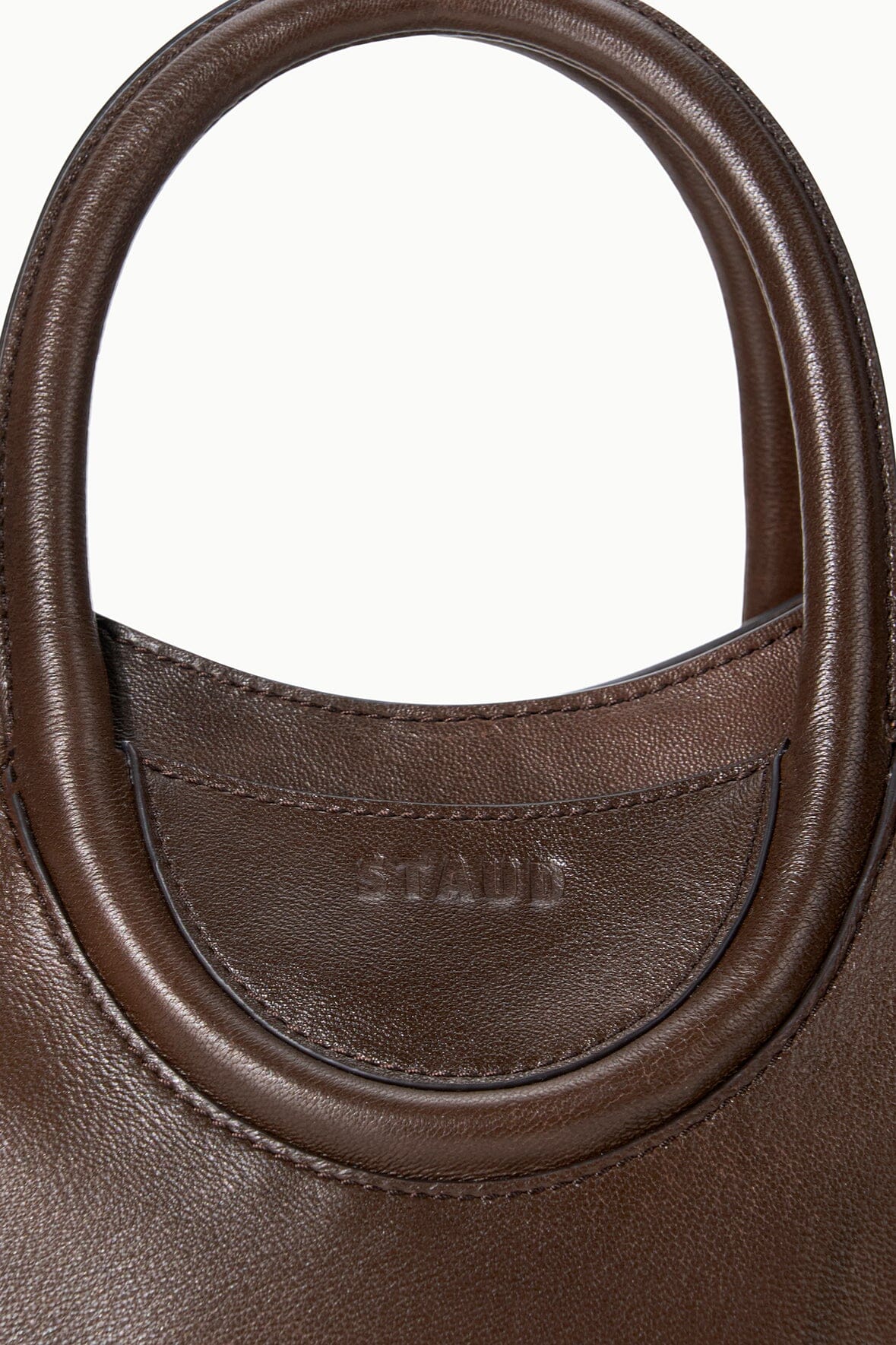 MAUDE mini tote handle close-up in espresso distressed brown leather with stitched trim