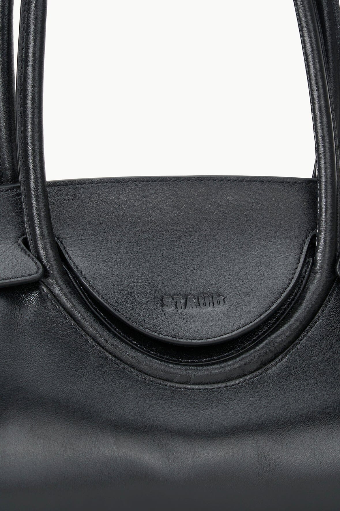 Black shoulder bag front logo on curved handle opening