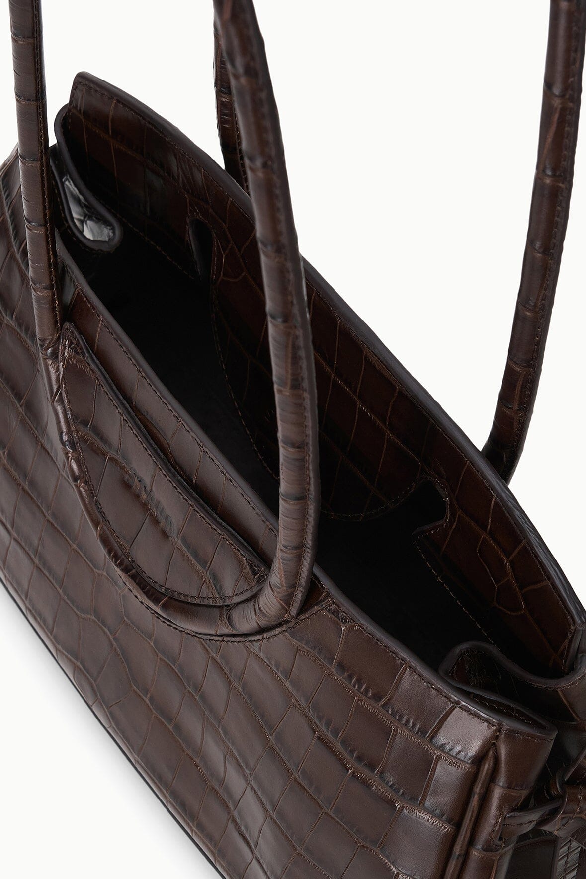 Croc-embossed shoulder bag interior with pocket and handle loops