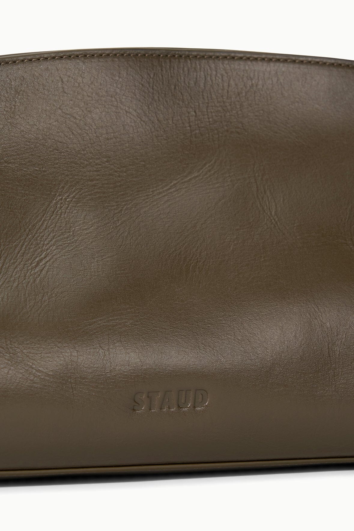 Truffle-brown leather clutch with embossed STAUD logo on front panel