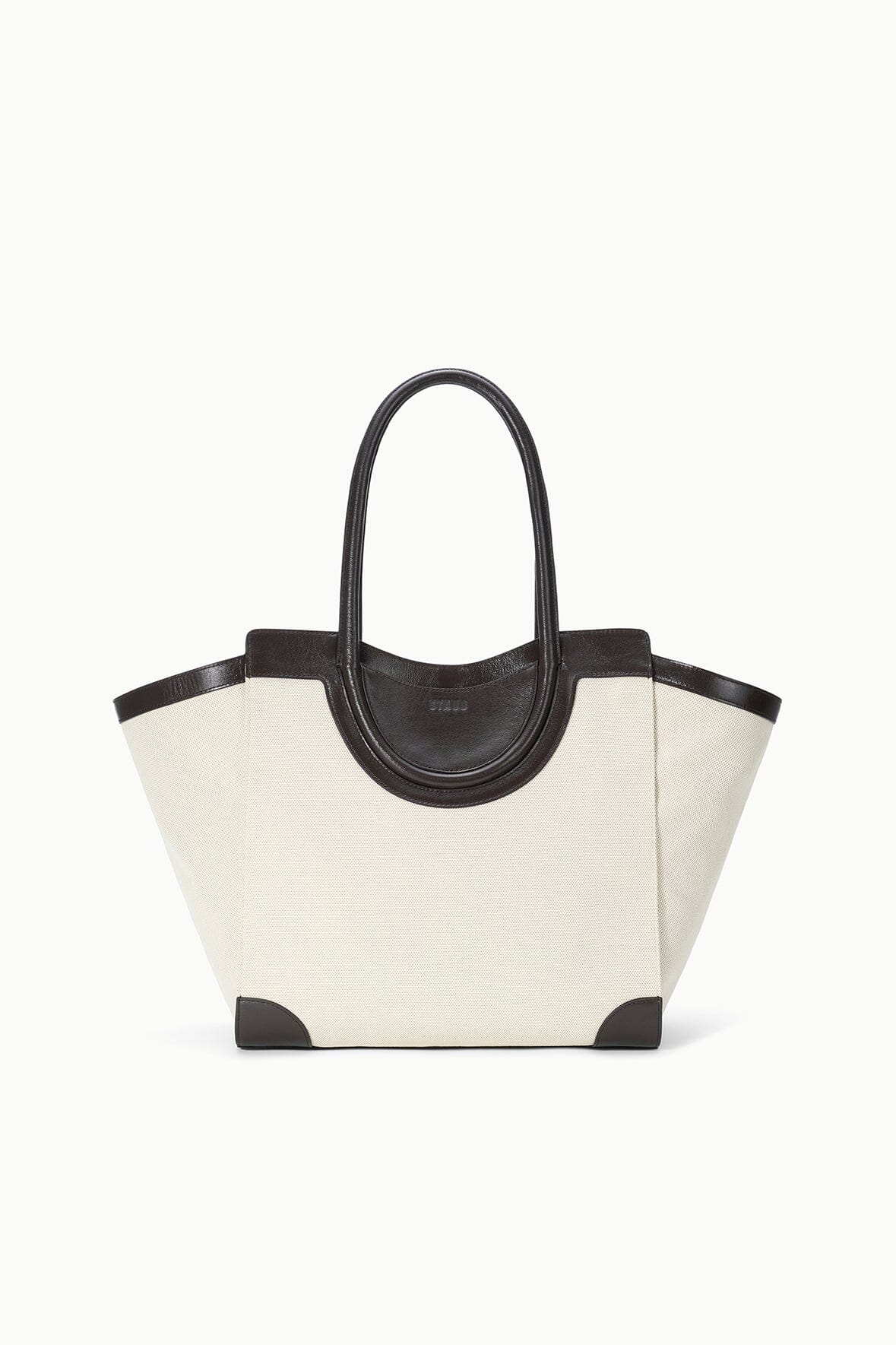 Two-tone tote bag with cream canvas body and dark leather handles