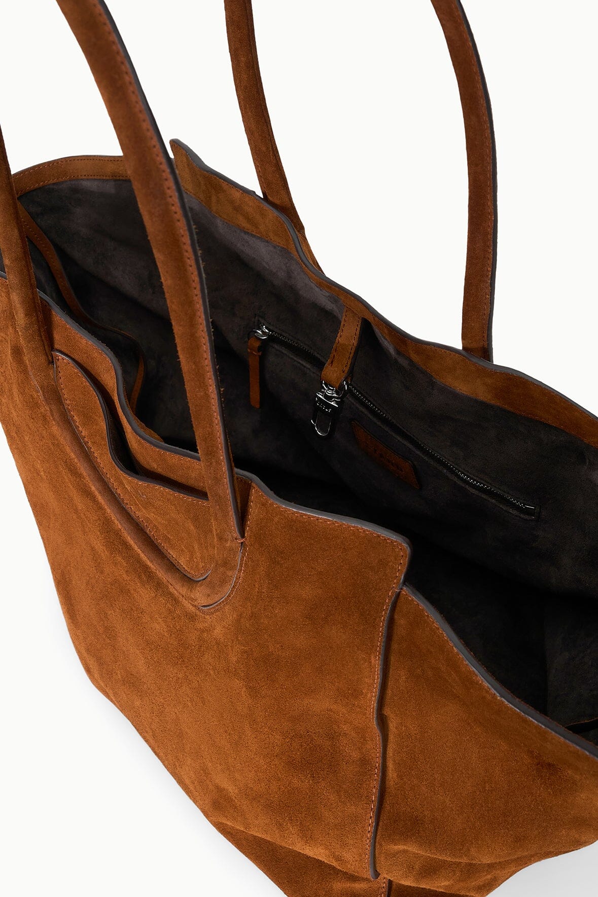 Tabac suede tote bag interior view with black lining and zip pocket
