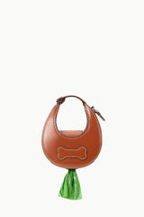 Tan micro moon poop bag carrier with hanging green bag and top hardware