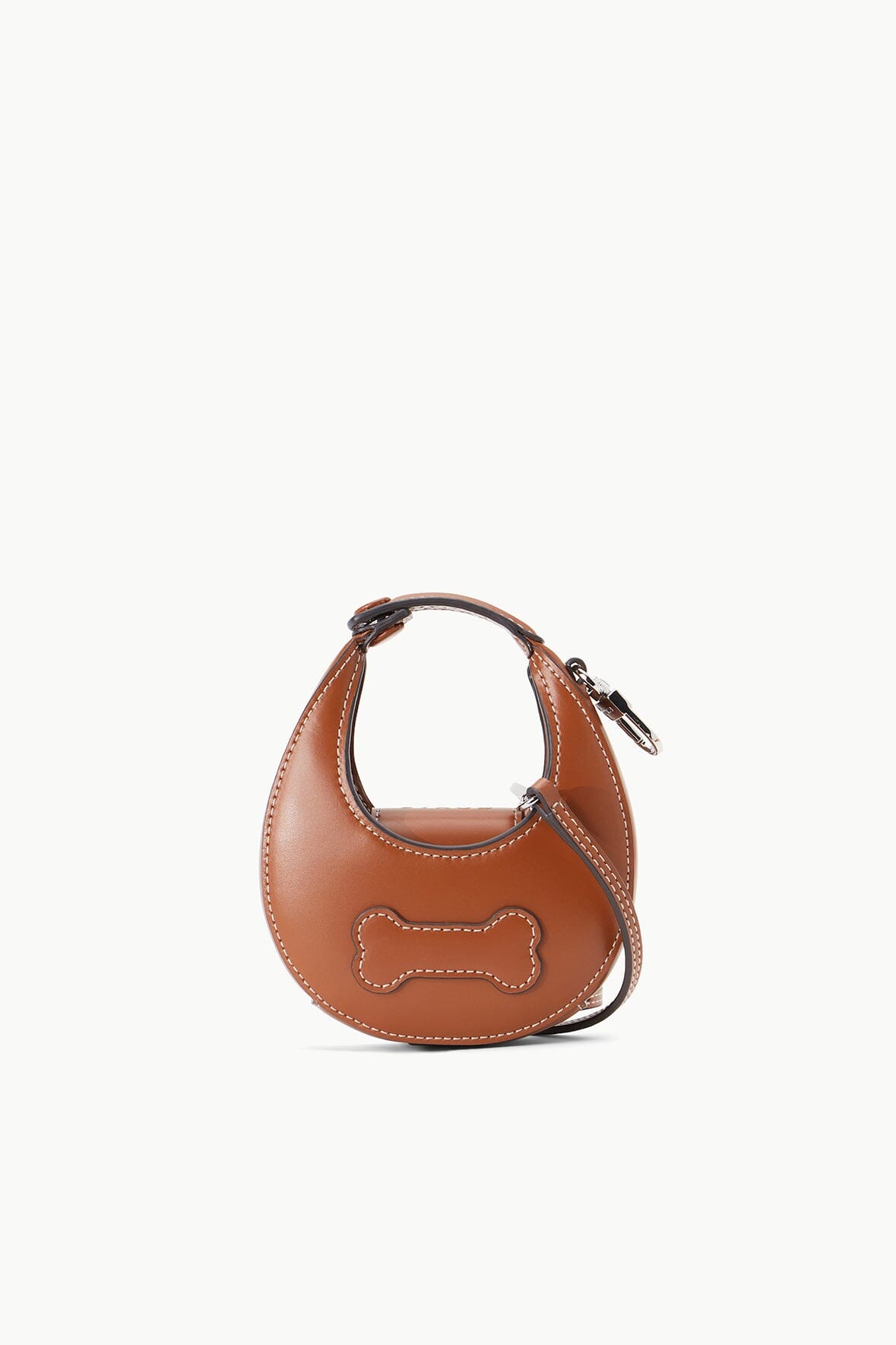 Tan micro moon poop bag carrier with bone applique and stitched edges