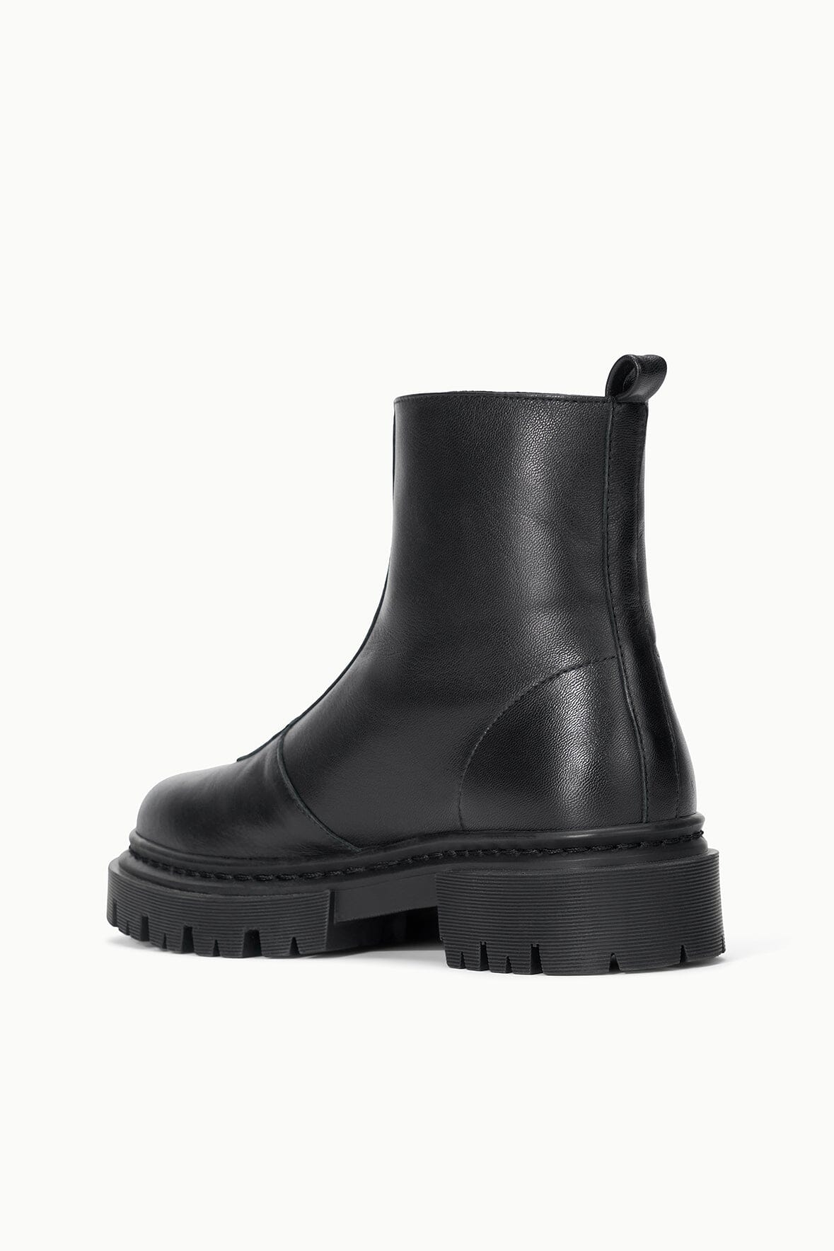 Black leather ankle boot with pull tab and chunky platform lug sole.