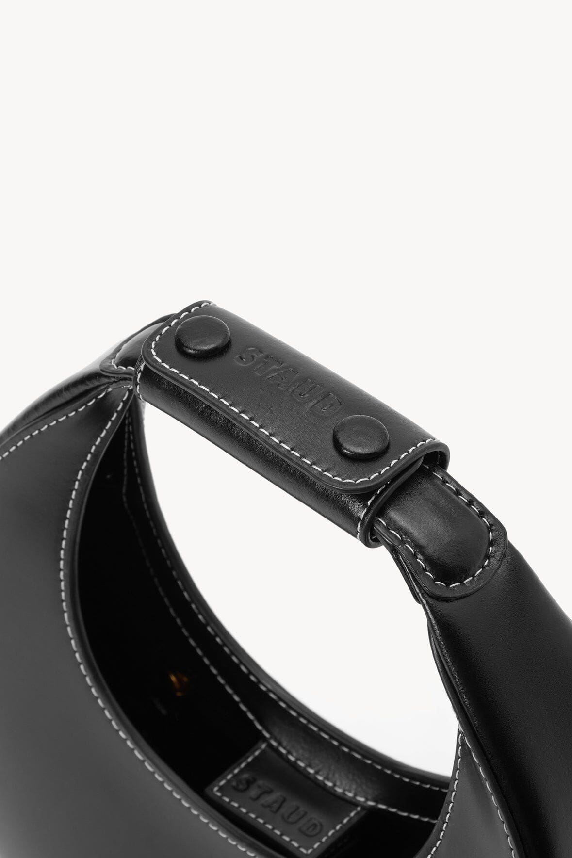 Black mini moon bag handle with snap rivets and stitching