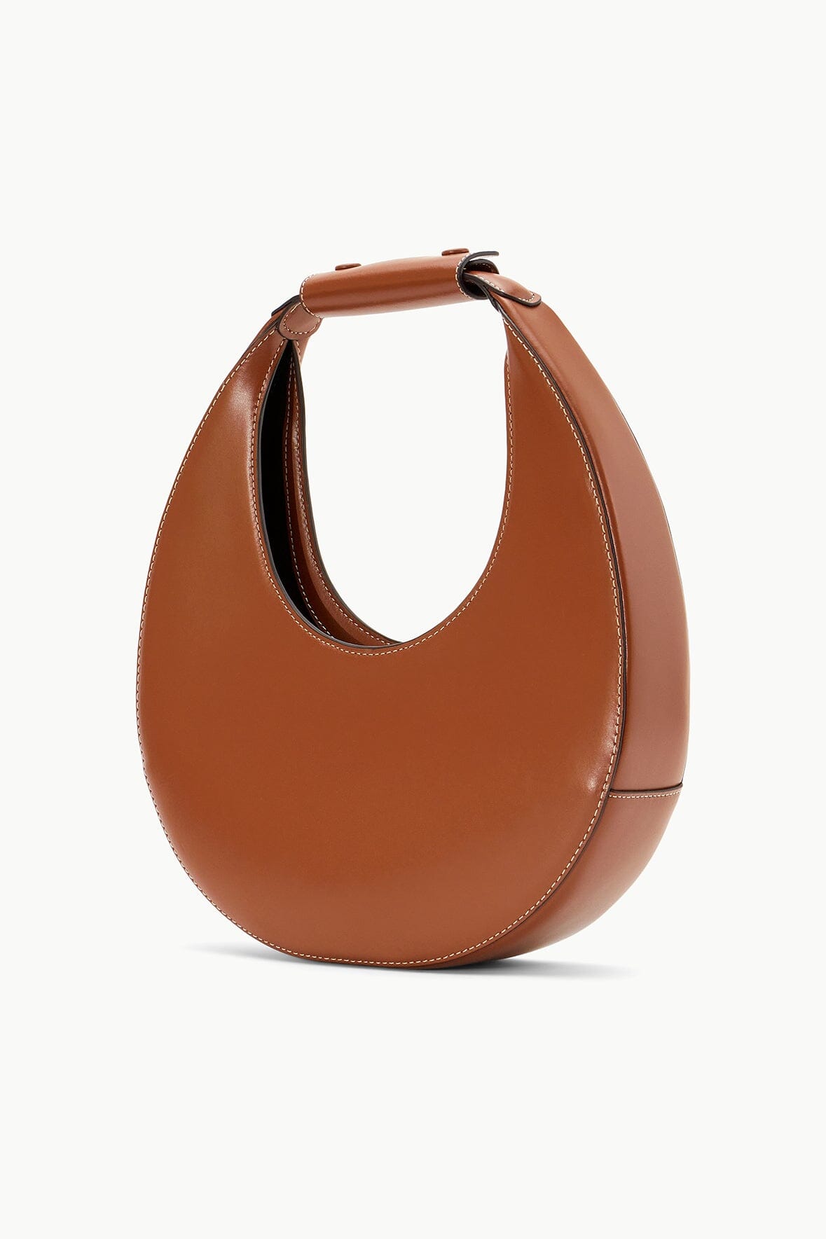 Tan crescent moon bag with wide strap and stitched leather handles