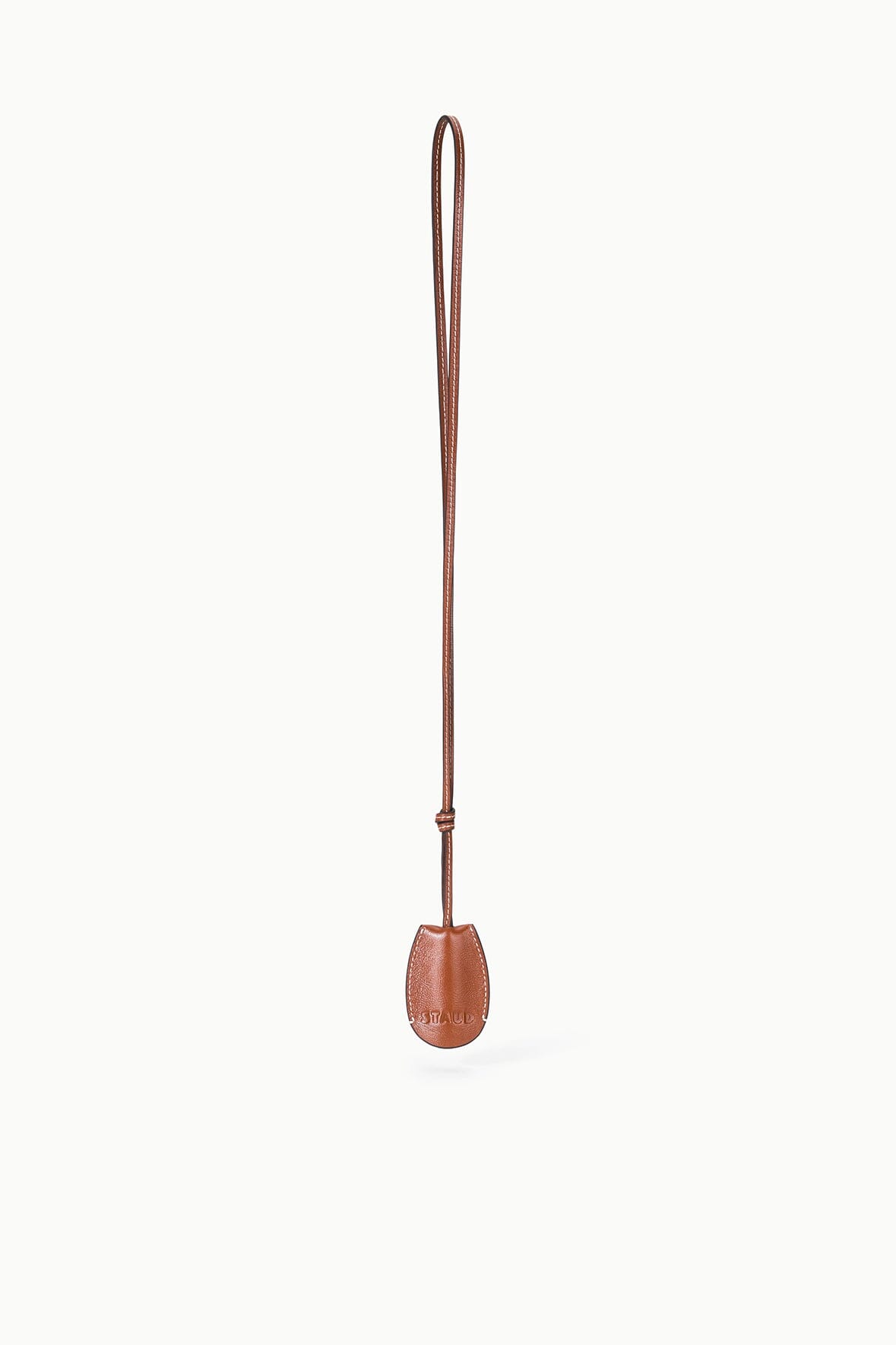 Tan-brown leather whistle pouch with long strap, hanging