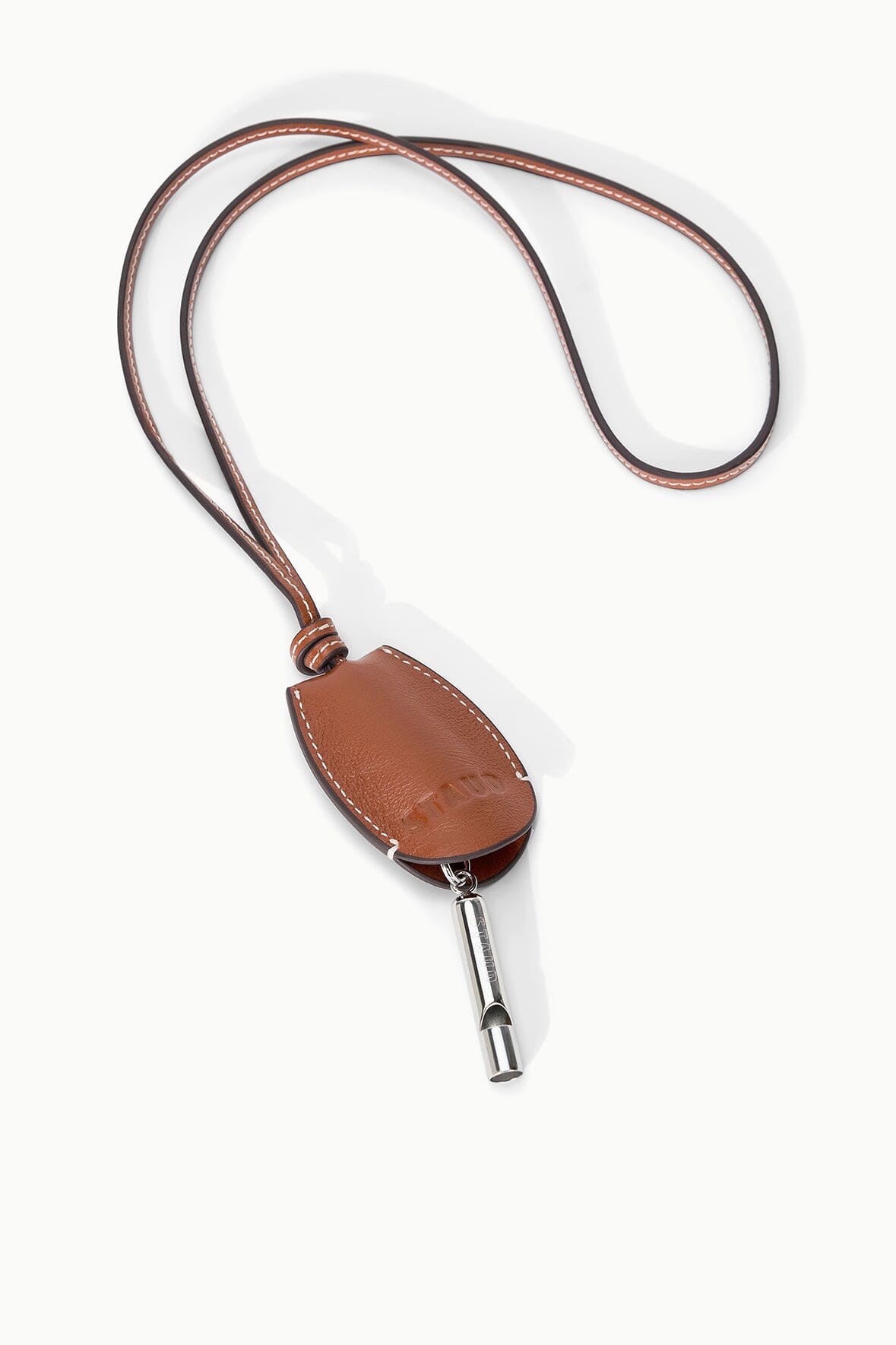 Tan-brown leather whistle pouch on cord with exposed metal whistle