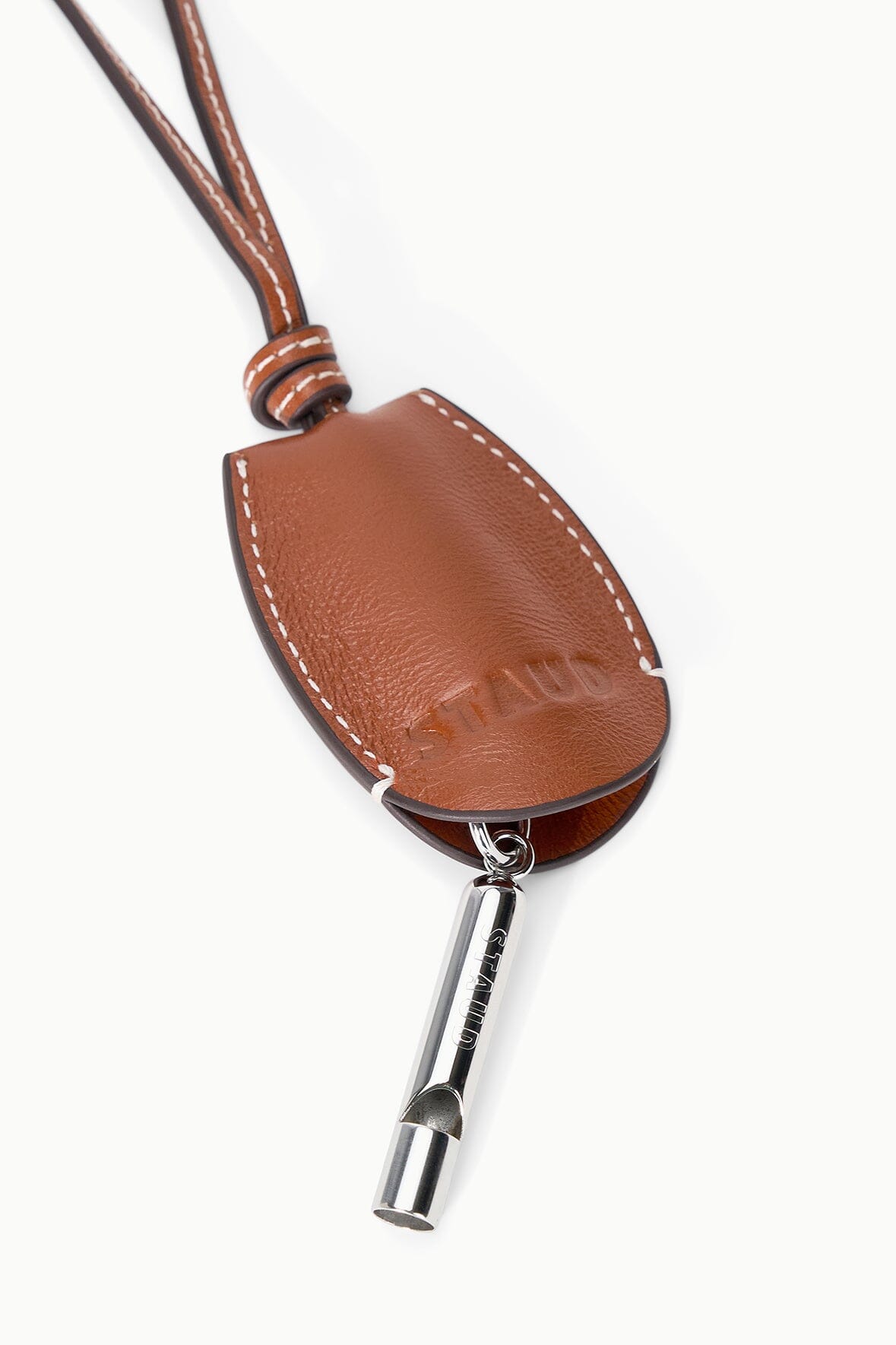 Tan-brown leather whistle pouch with metal whistle end and hanging ring
