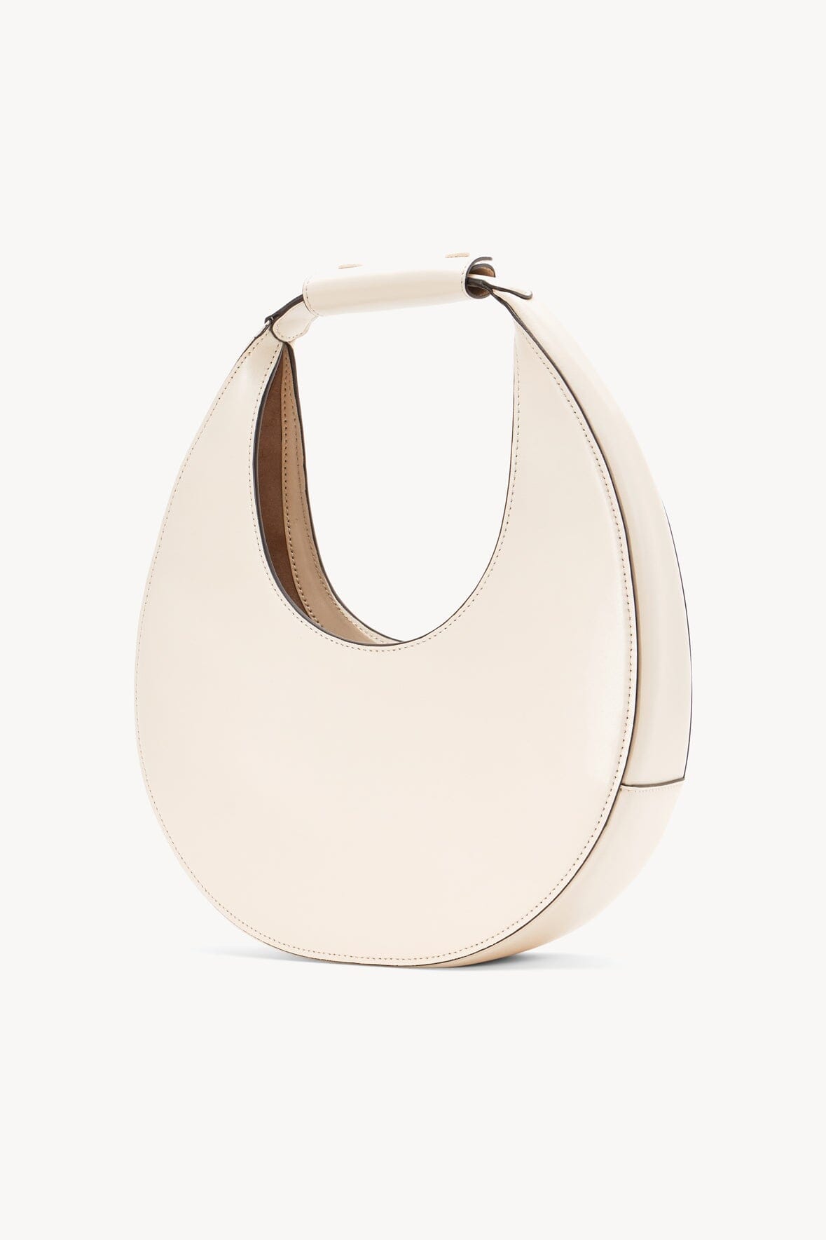 Cream crescent moon bag with top handle loops and double-stitched seams