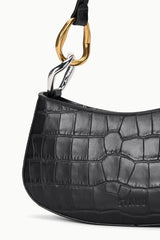 Black croc-embossed hobo bag close-up with gold clasp hardware