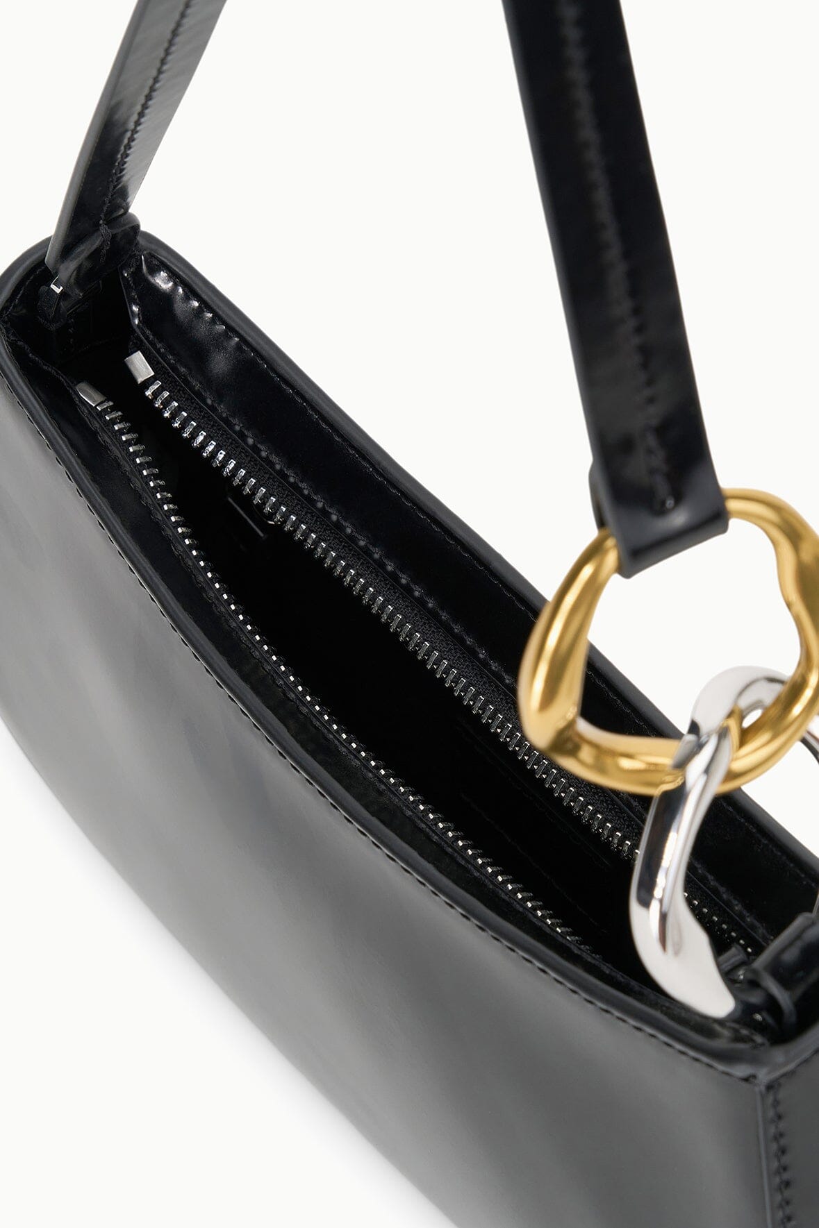 Black bag with double zippers and detailed stitched lining