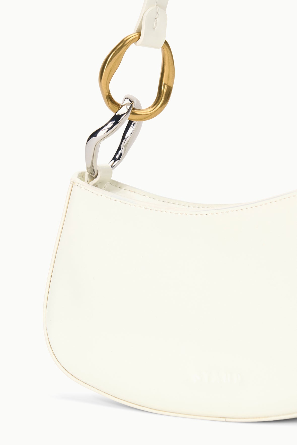 Off-white hobo bag strap with gold ring and metal clasp detail near the opening.