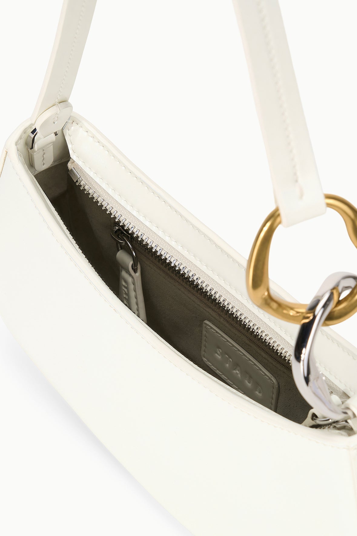 Off-white hobo bag interior view with zippered opening and fabric lining.