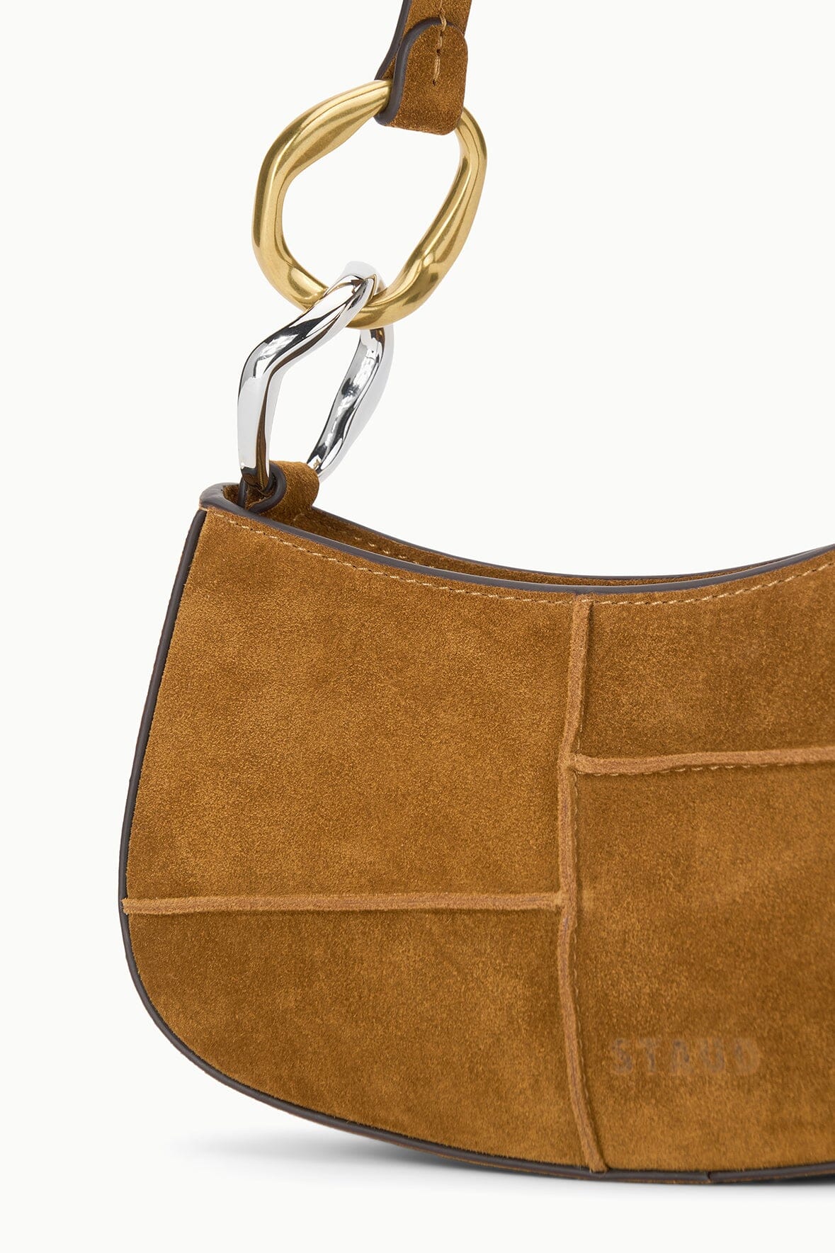 Tan suede hobo bag with gold-tone ring strap and stitched panel detail