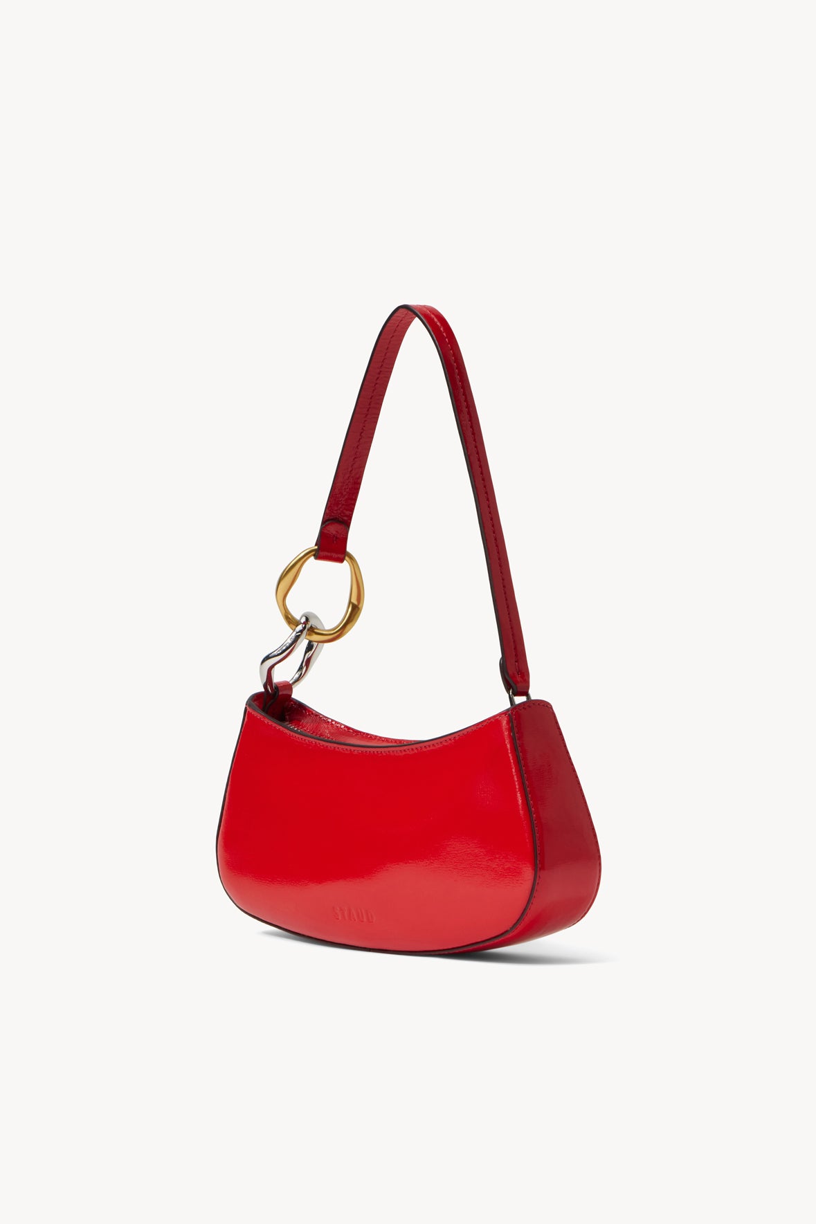 Red shoulder bag with short straps and gold ring hardware