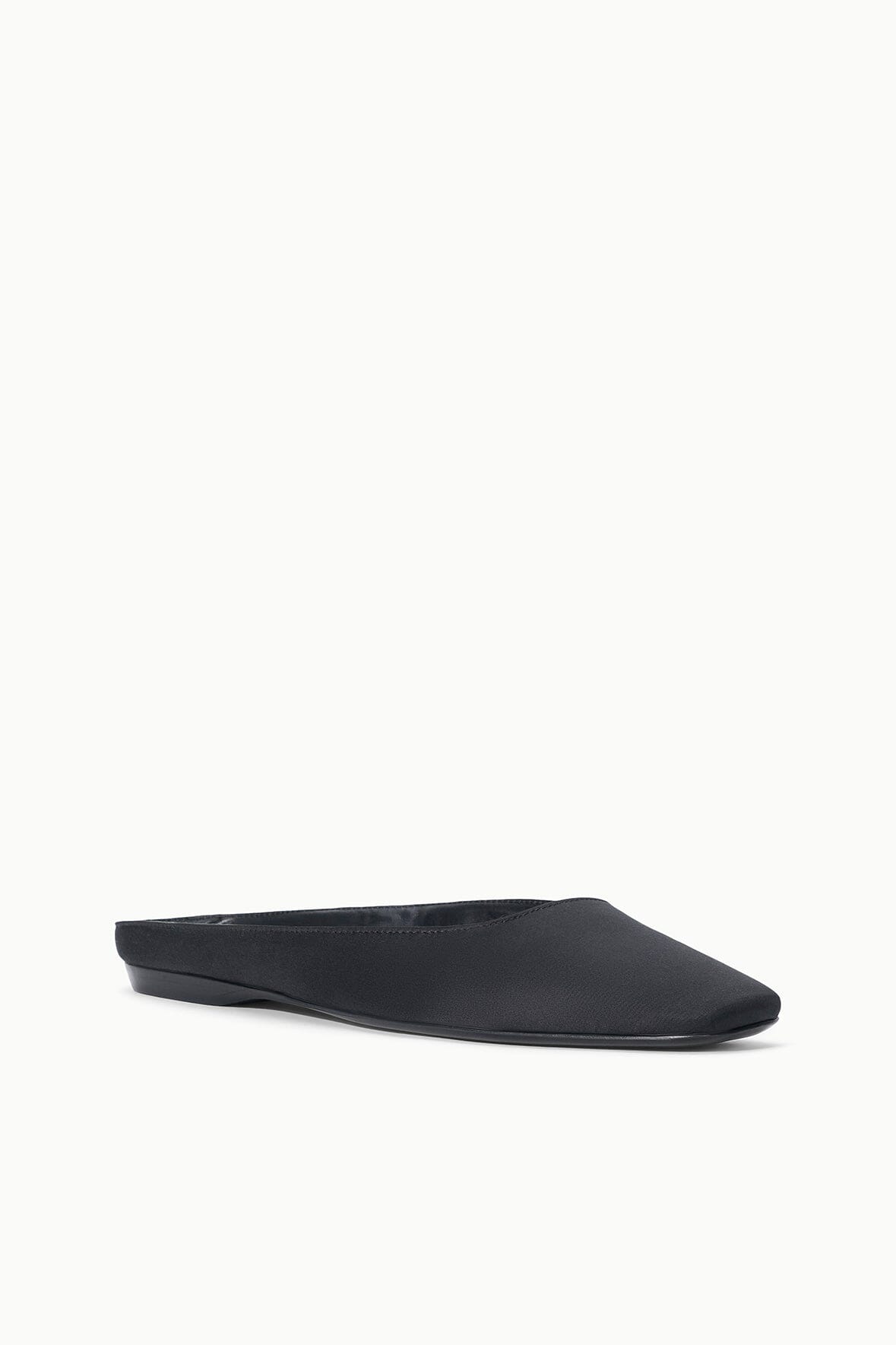 Black slip-on flat mule, side view with pointed toe