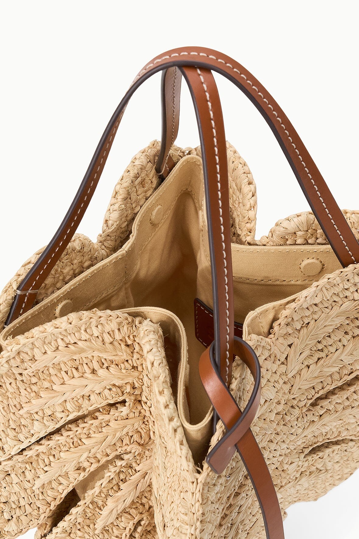 Natural tan raffia leaf tote bag open interior with tan leather top handles