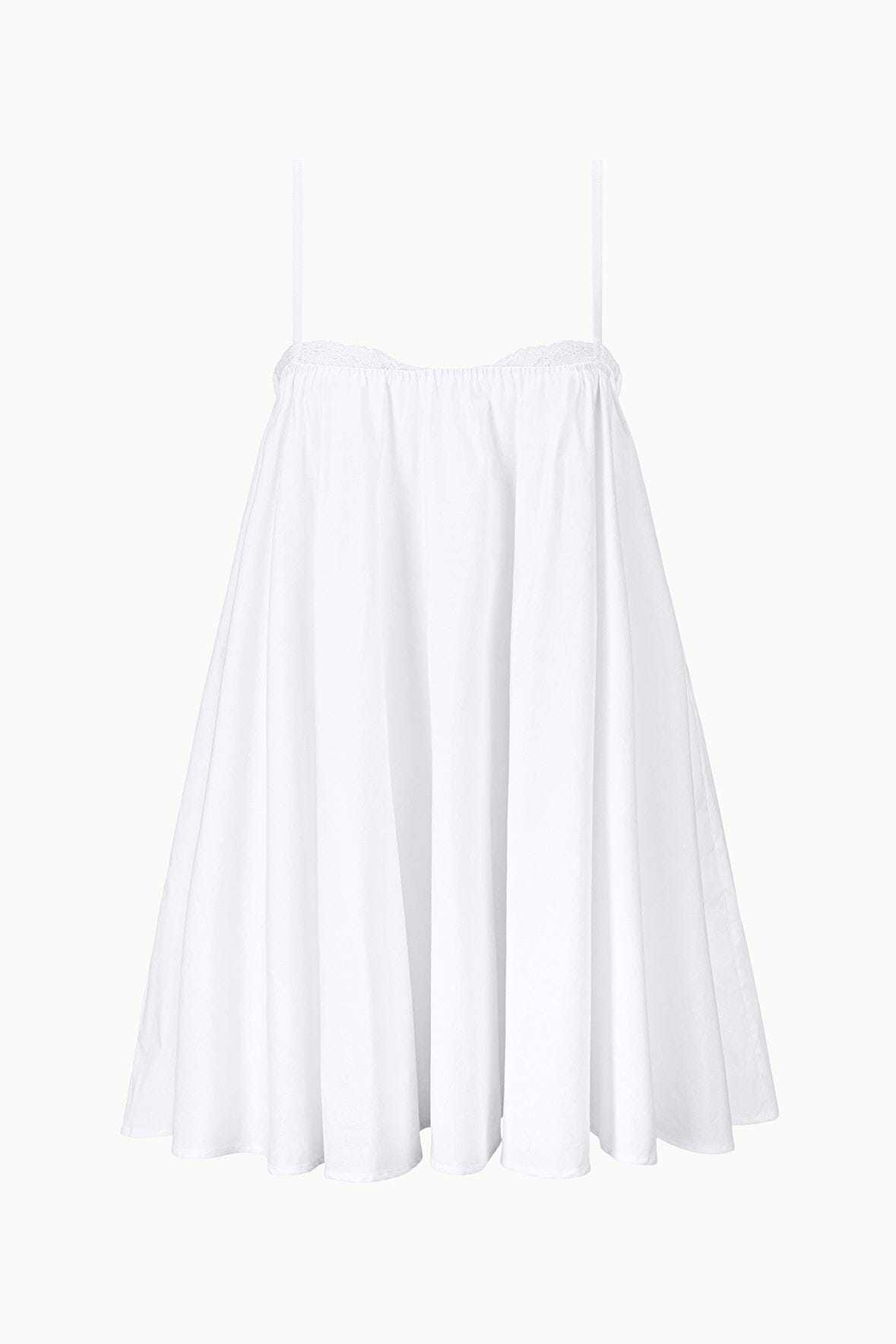 White mini dress flat lay: spaghetti straps and pleated flared skirt.