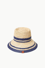 Striped straw bucket hat with navy bands and tan leather logo patch