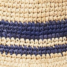 Close-up of striped straw bucket hat weave with navy and tan bands