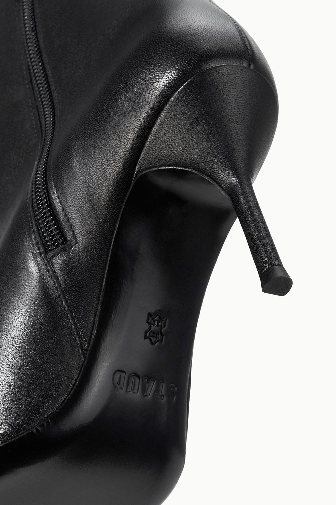Black leather ankle boots with side zipper and heel logo detail