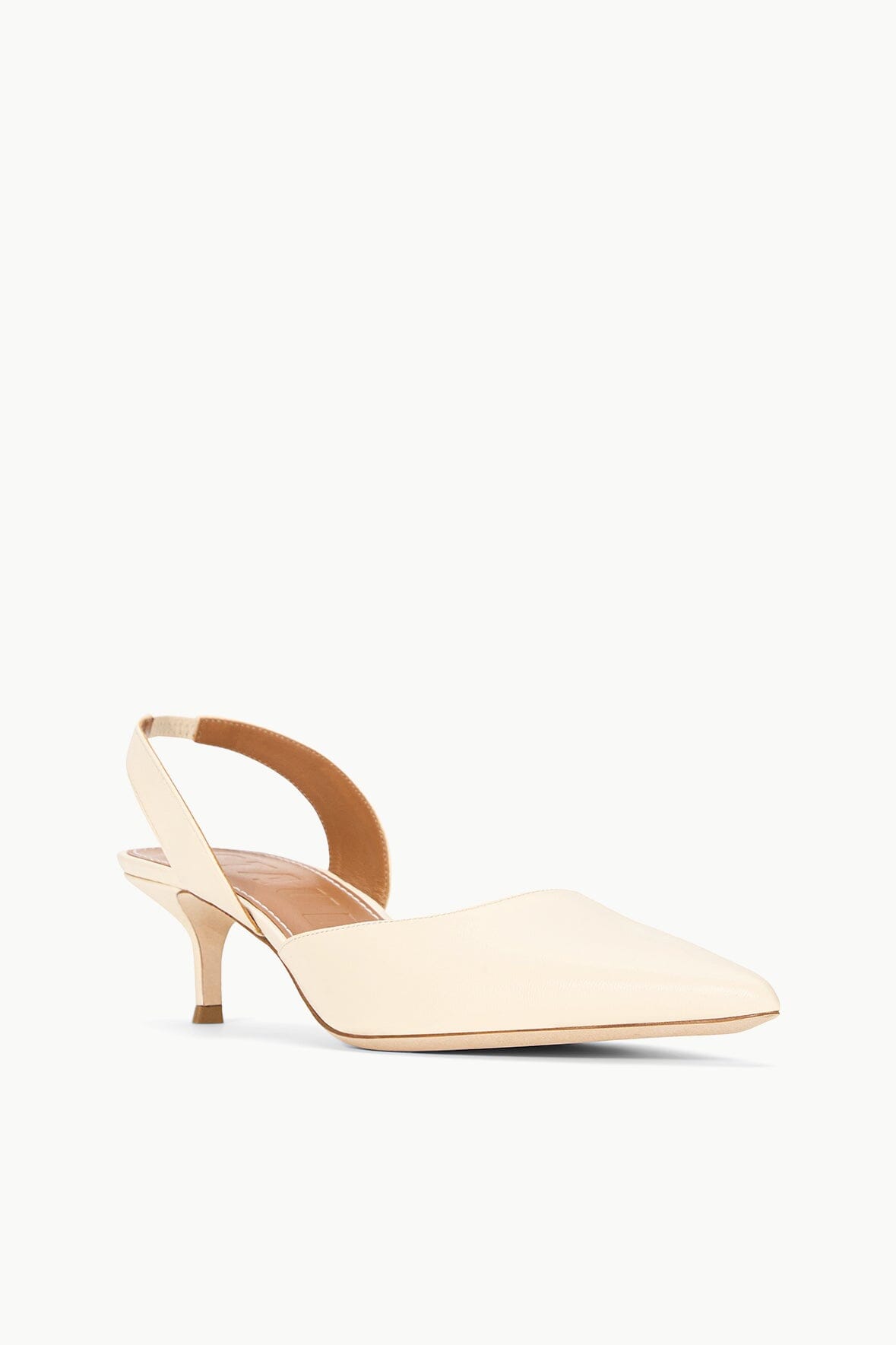 SEBASTIAN cream slingback heels, side view with pointed toe and slim heel