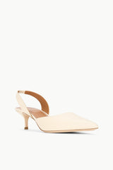 SEBASTIAN cream slingback heels, side view with pointed toe and slim heel