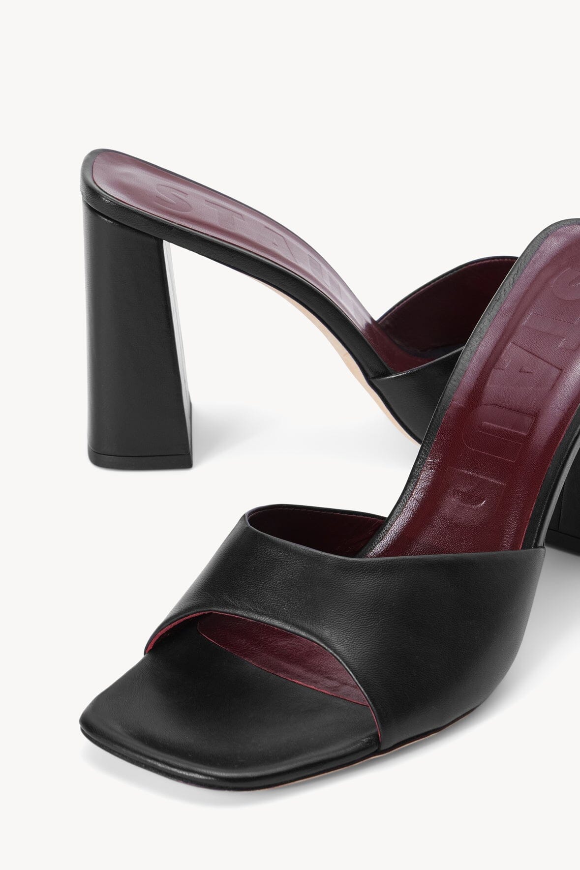 Black SLOANE mule sandal detail with square toe and thick block heel, burgundy lining