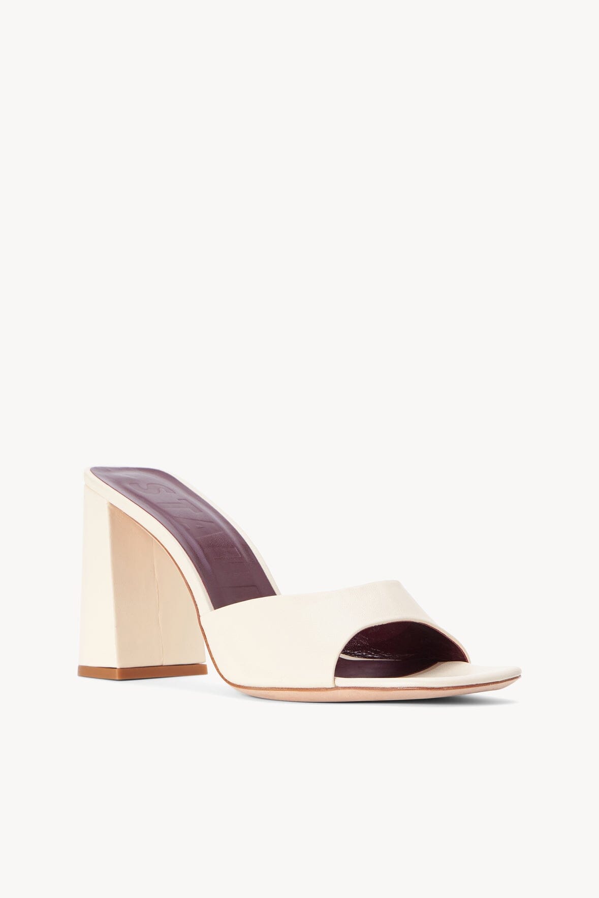 Cream open-toe heeled mule with dark interior lining