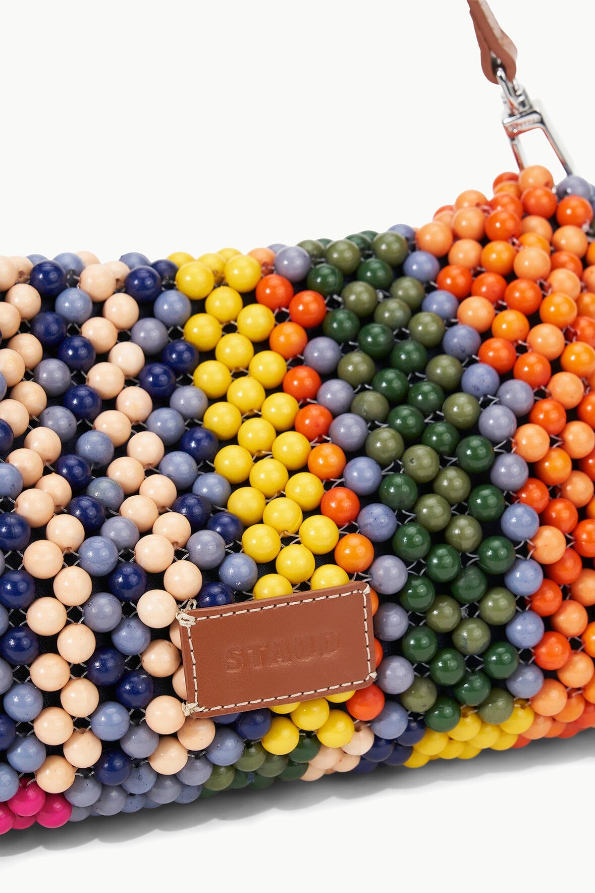 TIMMY beaded shoulder bag with multicolor bead stripes and brown leather brand patch.