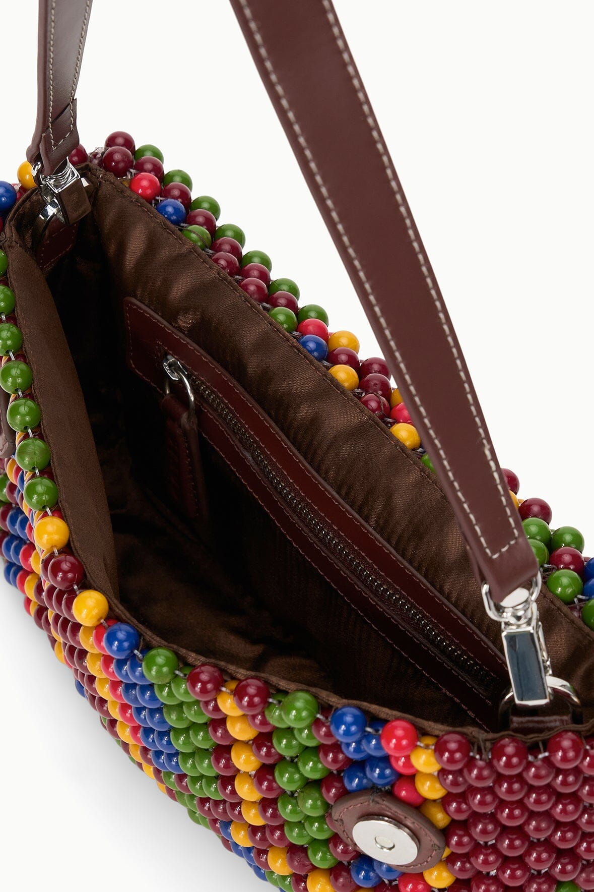 Multicolor beaded shoulder bag open with brown lining and zipper detail