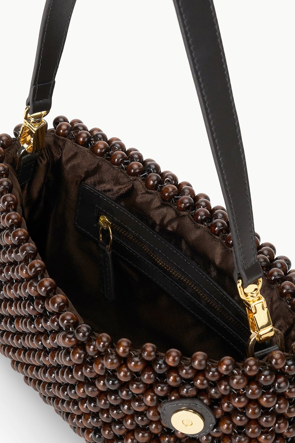 Dark brown beaded shoulder bag with gold-tone chain strap and front emblem detail