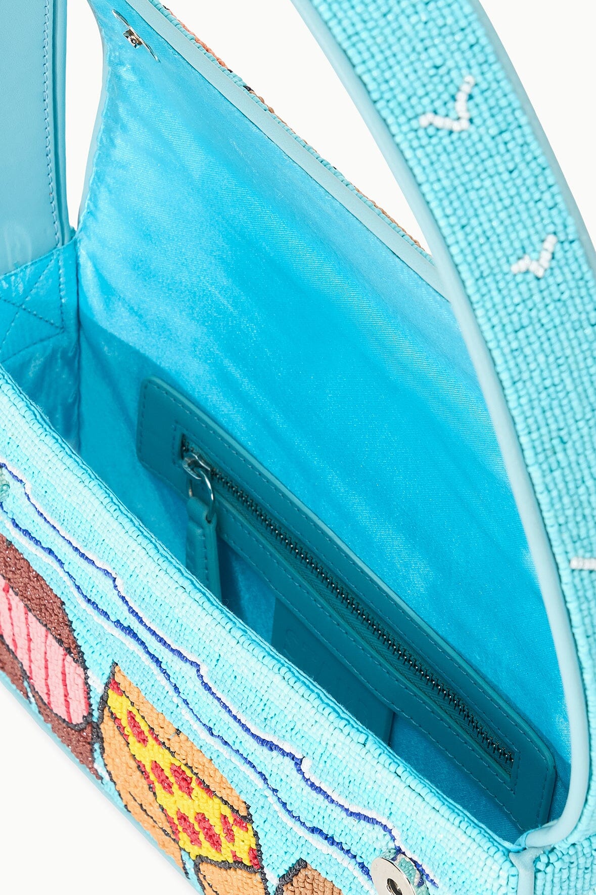 TOMMY beaded beach bag open interior with blue lining and beaded trim